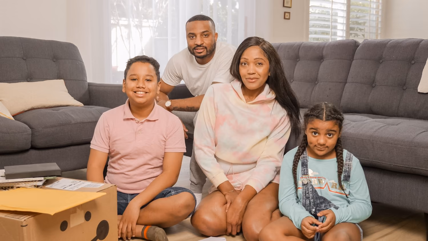 A family relaxing together in a bright living room